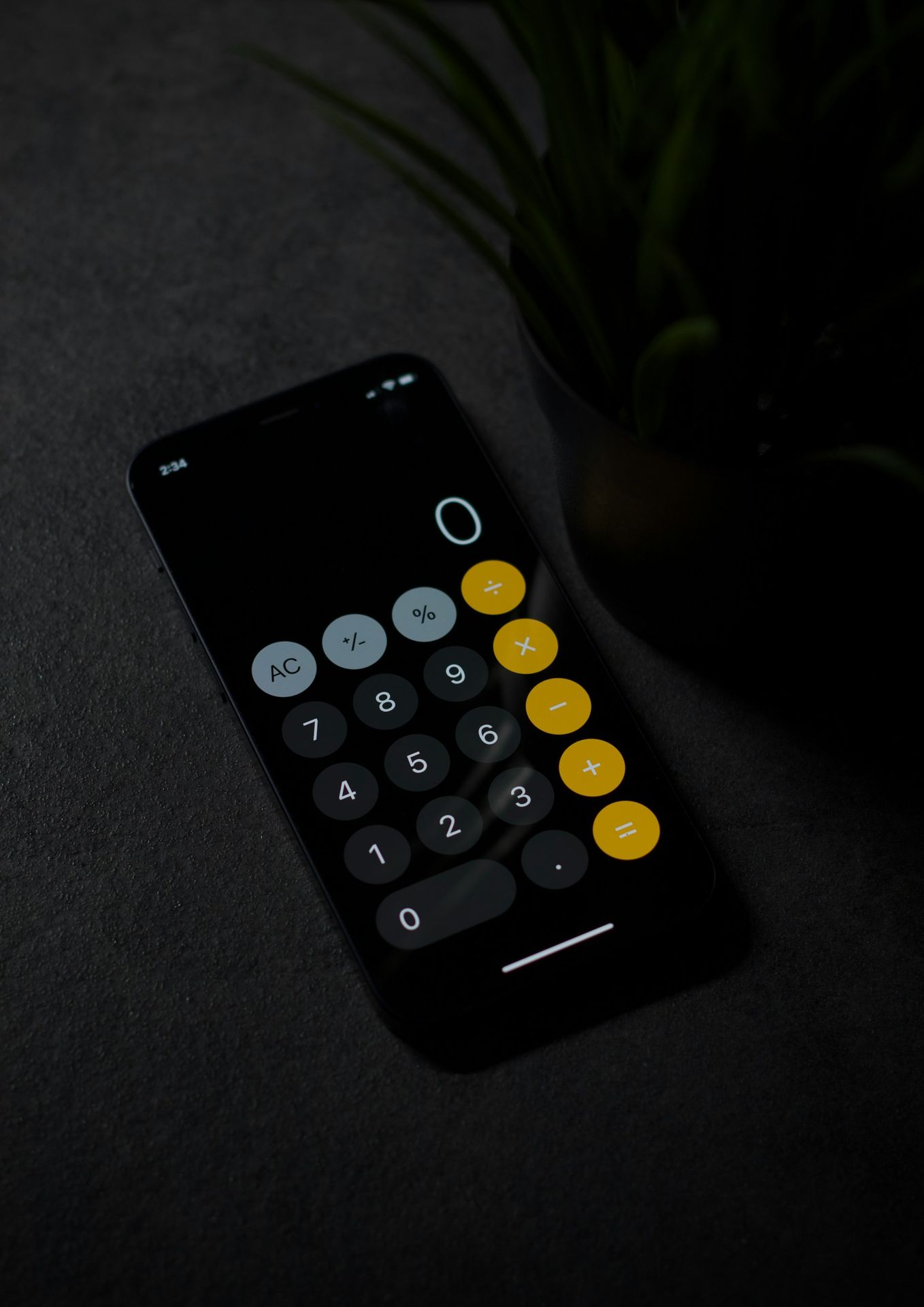 black remote control on gray textile